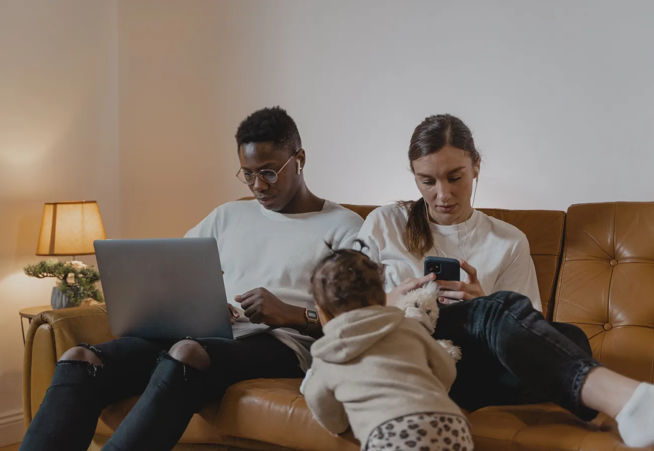 Household using a laptop and mobile devices while comparing internet options